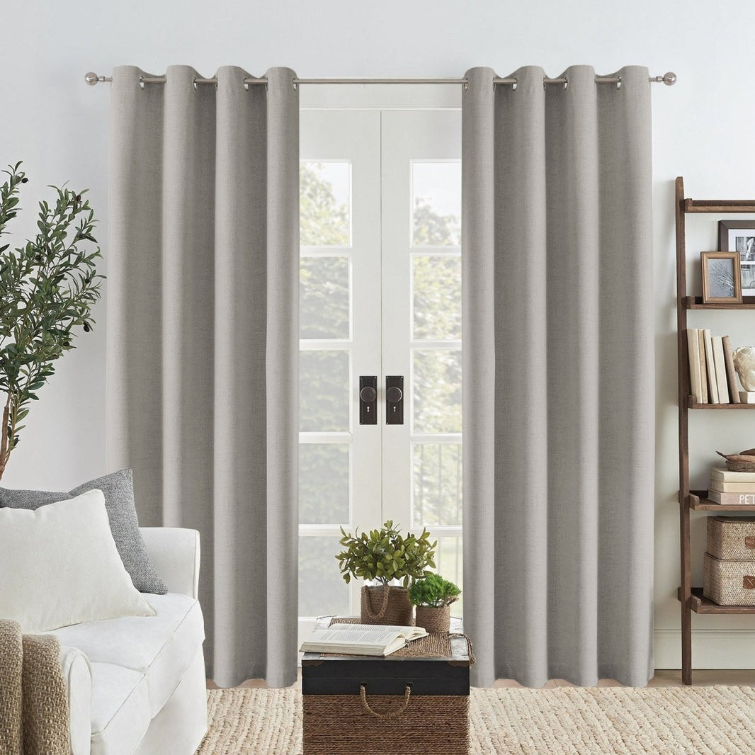 Joydeco Custom Faux Linen Blackout Curtain in greyish white, grommet top, framing a glass door